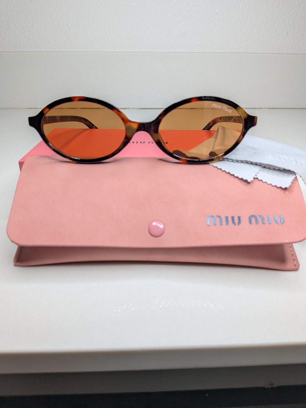 Miu Miu Tortoiseshell Oval Sunglasses in Brown - Picture 5 of 11